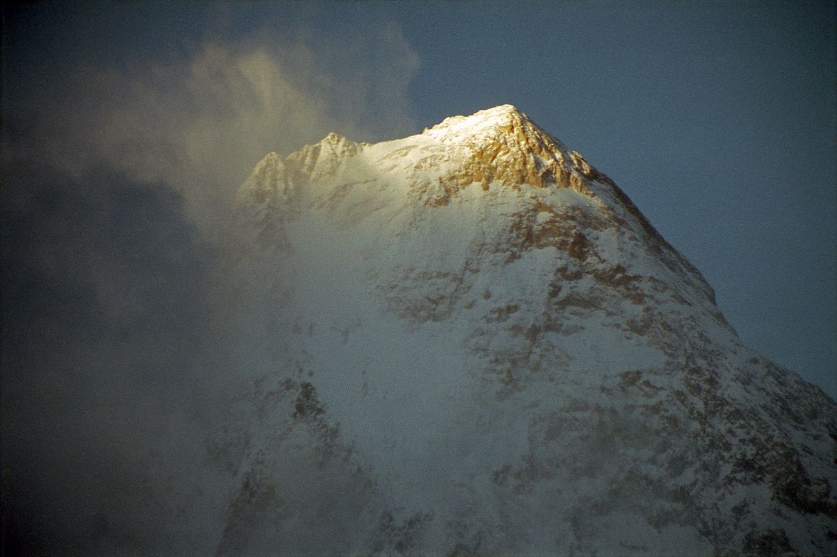 12 Gasherbrum IV Close Up At Sunset From Concordia The clouds covering the summit of Gasherbrum IV cleared a bit to reveal the summit ridge at sunset seen from Concordia.